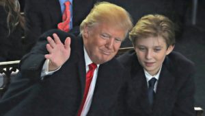 Barron Trump with his father Donald Trump