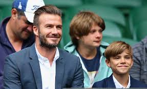 Romeo Beckham with his father