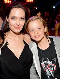 Shiloh Jolie-Pitt with her mother
