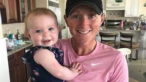 Stacy Lewis with her daughter