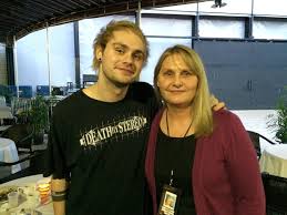 Michael Clifford with his mother