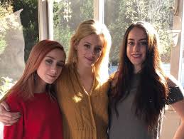 Lili Reinhart with her sisters