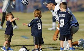 Tony Romo with his sons