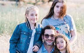 Tom Ellis with his daughters