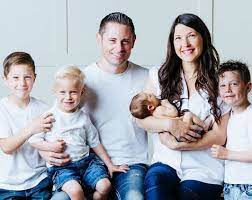 Grant Thompson with his wife & children
