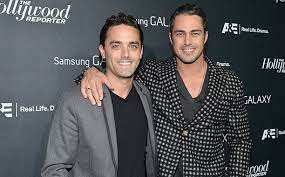 Taylor Kinney with his brother