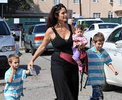 Carrie Anne Moss with her kids