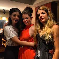 Lorde with her sisters